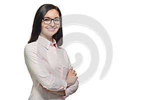 Portrait of young confident smiling woman in glasses with folded hands on white isolated background, copy space