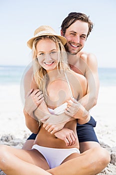 Portrait of young couple embracing on the beach