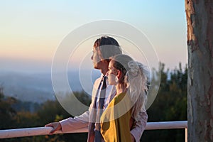 Portrait of young couple in love dressed as wedding guests