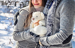Portrait of young couple in love with teddy bear