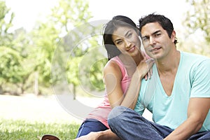 Portrait Of Young Couple In Park