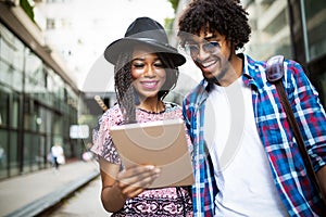 Portrait of a young couple travelling and having fun