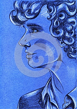 Portrait of young curly haired man on blue paper background