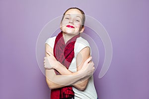 Portrait of a young cute woman with red scarf and freckles on her face smiling happiness carefree emotional expression concept