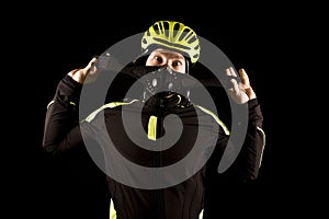 Portrait of young cyclist fully equipped for race in helmet and and mask.
