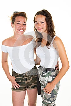 Portrait young daughter teenage hugging her beautiful mother standing under white background