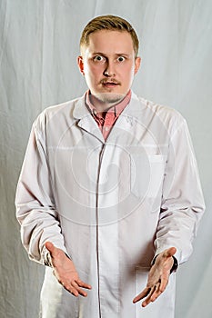 The  portrait of young doctor wearing white coat