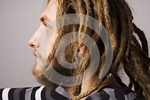 Portrait of young dreadlock man photo