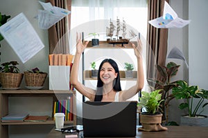 Portrait of a young excited intern celebrating success at office, this image can use for office