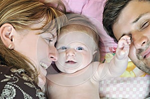 Portrait of young family with cute little babby