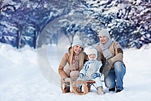 Portrait of Young family in a winter park