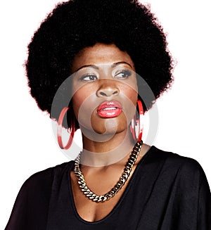 Portrait of young fashionista african american woman wearing red earrings