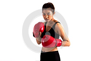 Portrait of a young female boxer in a fighting stance on white isolated background