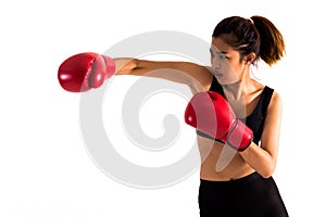 Portrait of a young female boxer punching on white isolated background with copy space