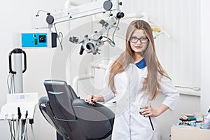 Portrait of young female dentist at the modern dental office