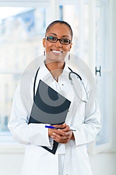 Portrait of young female doctor in clinic