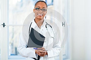 Portrait of young female doctor in clinic