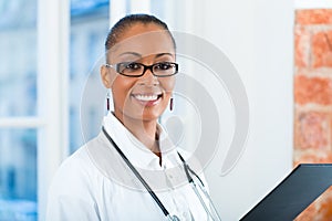 Portrait of young female doctor in clinic
