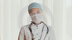 Portrait of a young female doctor in a mask.