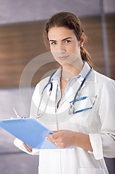 Portrait of young female doctor in modern hospital