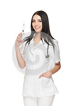 A portrait of a young female doctor smiling with a syringe in her hand