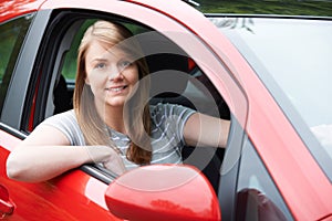 Portrait Of Young Female Driver In Car