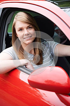 Portrait Of Young Female Driver In Car