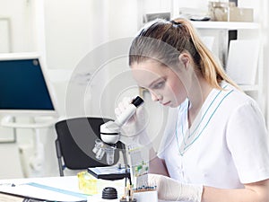 Portrait of a young female lab assistant, doctor or student in a