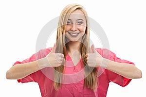Portrait of young female nurse wearing scrubs showing double like
