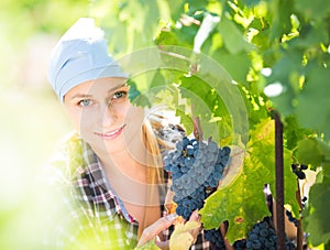 Portrait of young female worker at grape farm