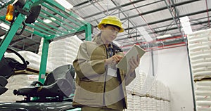Portrait of young female worker in a warehouse