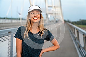 Portrait of young fit attractive happy fitness woman in city. People healthy lifestyle concept.