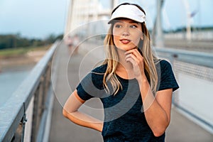 Portrait of young fit attractive happy fitness woman in city. People healthy lifestyle concept.