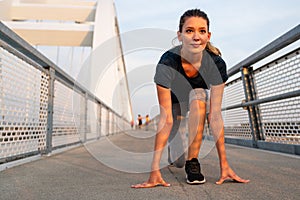 Portrait of young fit attractive happy fitness woman in city. People healthy lifestyle concept.