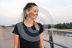 Portrait of young fit attractive happy fitness woman in city. People healthy lifestyle concept.