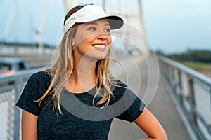 Portrait of young fit attractive happy fitness woman in city. People healthy lifestyle concept.