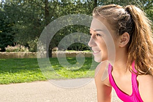 Portrait of young fit woman outdoors