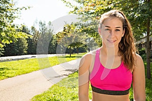 Portrait of young fit woman outdoors