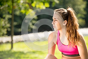 Portrait of young fit woman outdoors