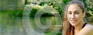 Portrait of young fit woman outdoors, horizontal photo banner