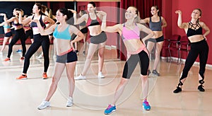 Portrait of young fitness females practicing zumba