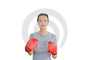 Portrait of young fitness sporty woman in sportswear with red boxing gloves punching hit isolates on white background. healthy