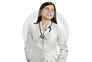 Portrait of young friendly beautiful female doctor smiling isolated on white background