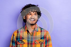 Portrait of young funny guy curls look empty space laughing enjoy good event advertisement invitation isolated on violet