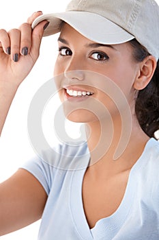 Portrait of young girl in baseball cap smiling