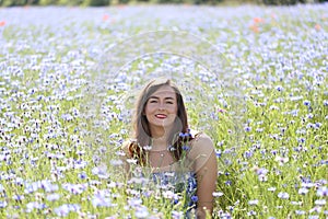 Portrait of a young girl on cornflower blue field