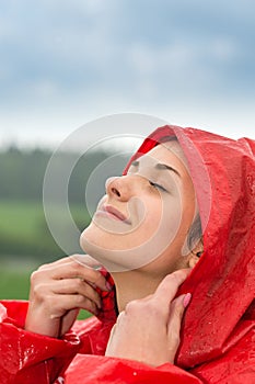 Portrait of young girl feeling the rain