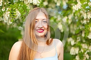 Portrait of young girl long hair plus size spring surrounde