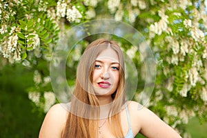 Portrait of young girl long hair plus size spring surrounde