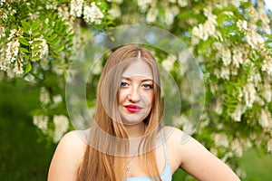 Portrait of young girl long hair plus size spring surrounde